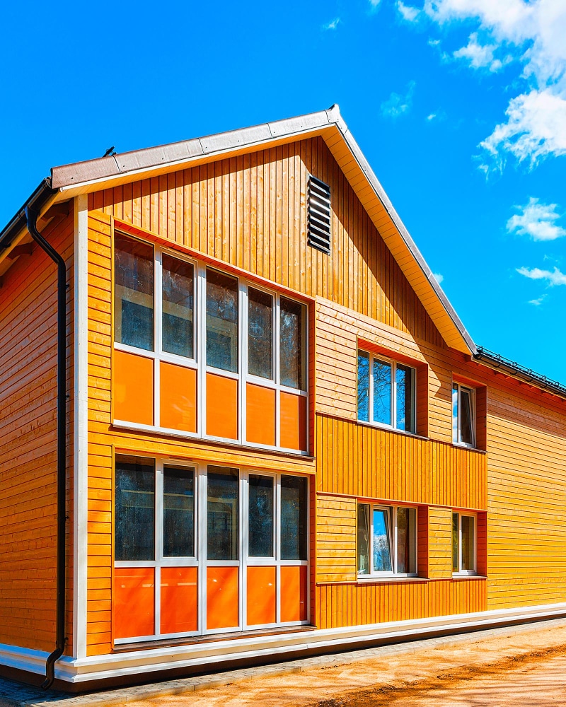 Многоэтажные дома из бруса: преимущества и особенности строительства